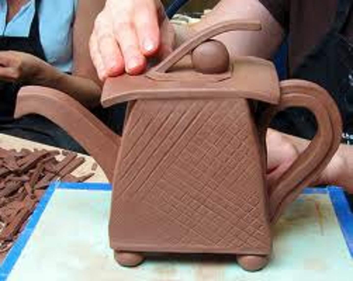 <p>A damp condition of the clay when it is too firm to bend yet soft enough to be carved.</p>