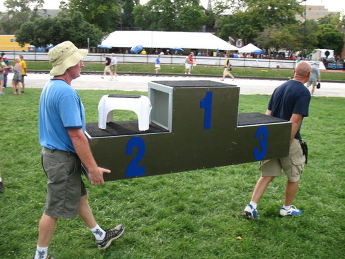 <p>a raised area on which a person stands to speak to a large number of people, to conduct music, or to receive a prize in a sports competition</p>