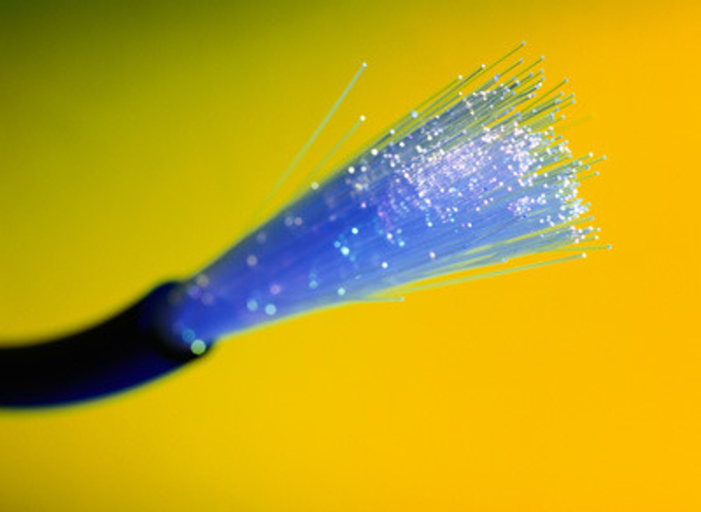 <p>Bundles of long strands of pure glass that efficiently transmit light pulses over long distances. Interception without detection is difficult.</p>