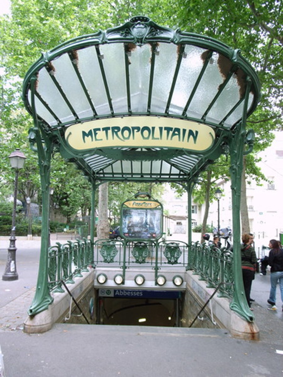 <p>Designed by Hector Guimard; 141 models of these were created between 1900 and 1913. The forms draw their inspiration from nature; most notable are the plant stems that support the signs.</p>