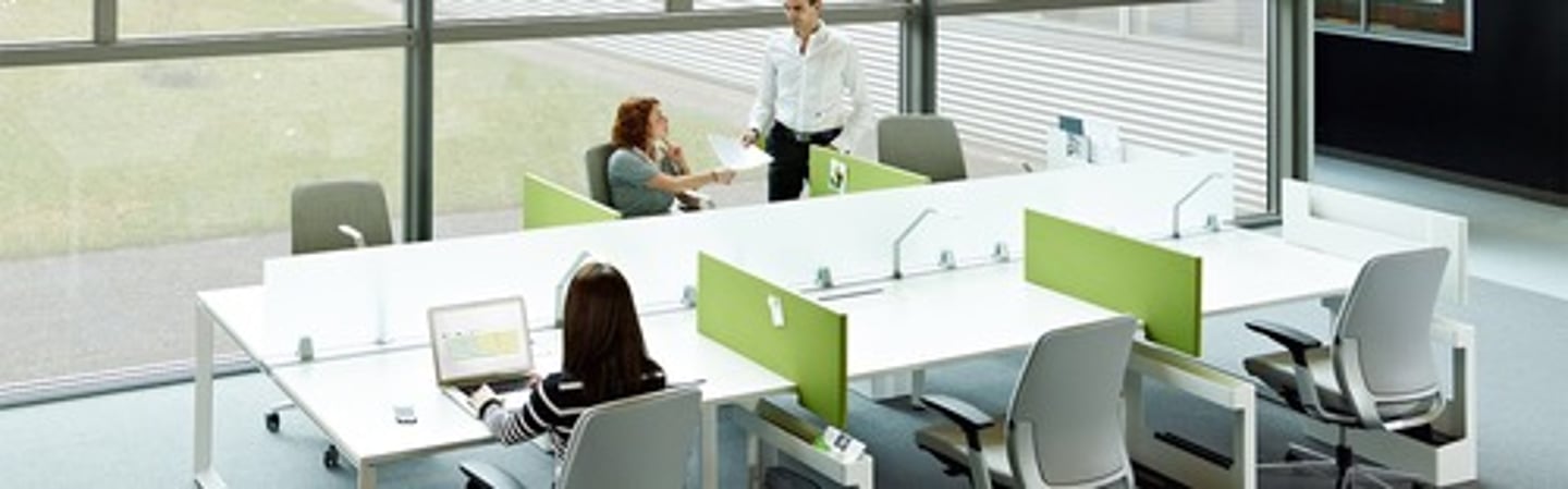 <p>a policy of sharing desks in an office, so people sit at whichever desk is free on a particular day</p>