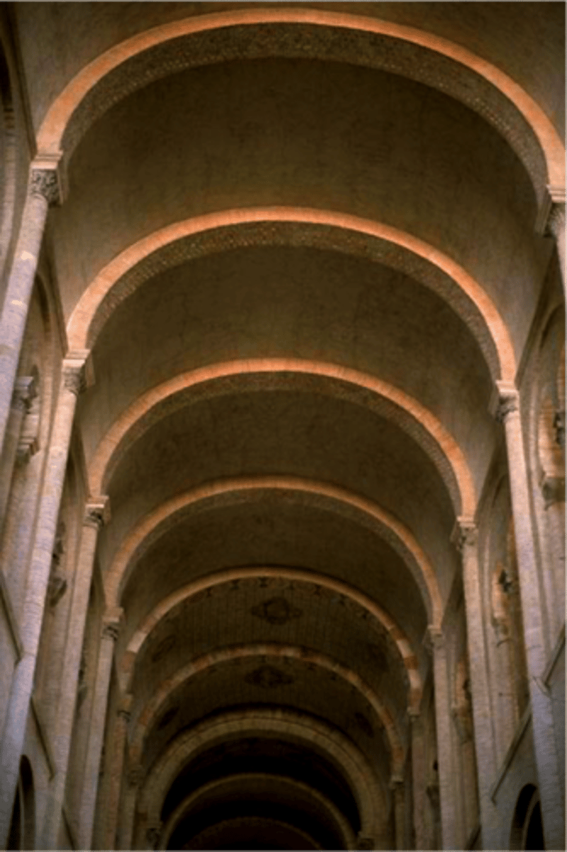 <p>A continuous series of arches that creates a semi-cylindrical ceiling or roof structure. It allows for the construction of large, open spaces and distributes weight evenly.</p>