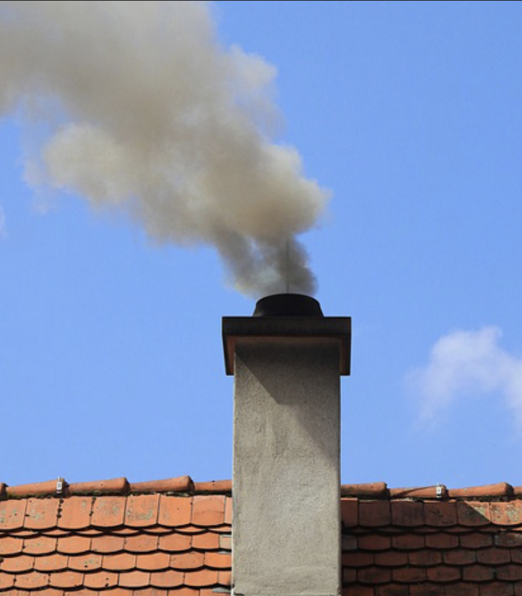 a tall pipe used to carry smoke out of a building