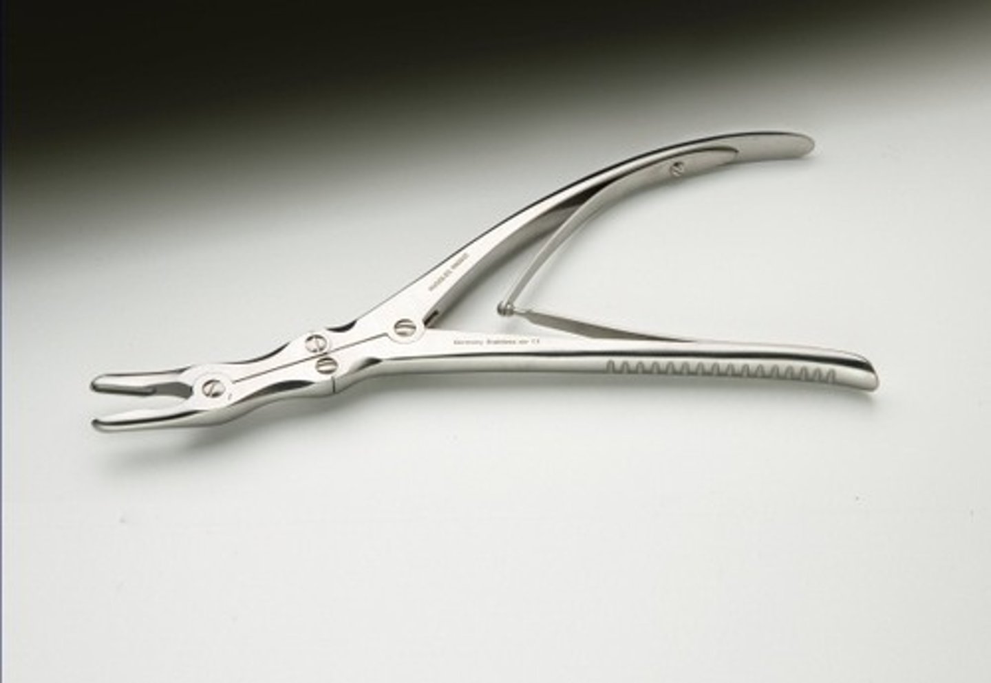 <p>Surgical instrument used to cut and trim the alveolar bone</p>