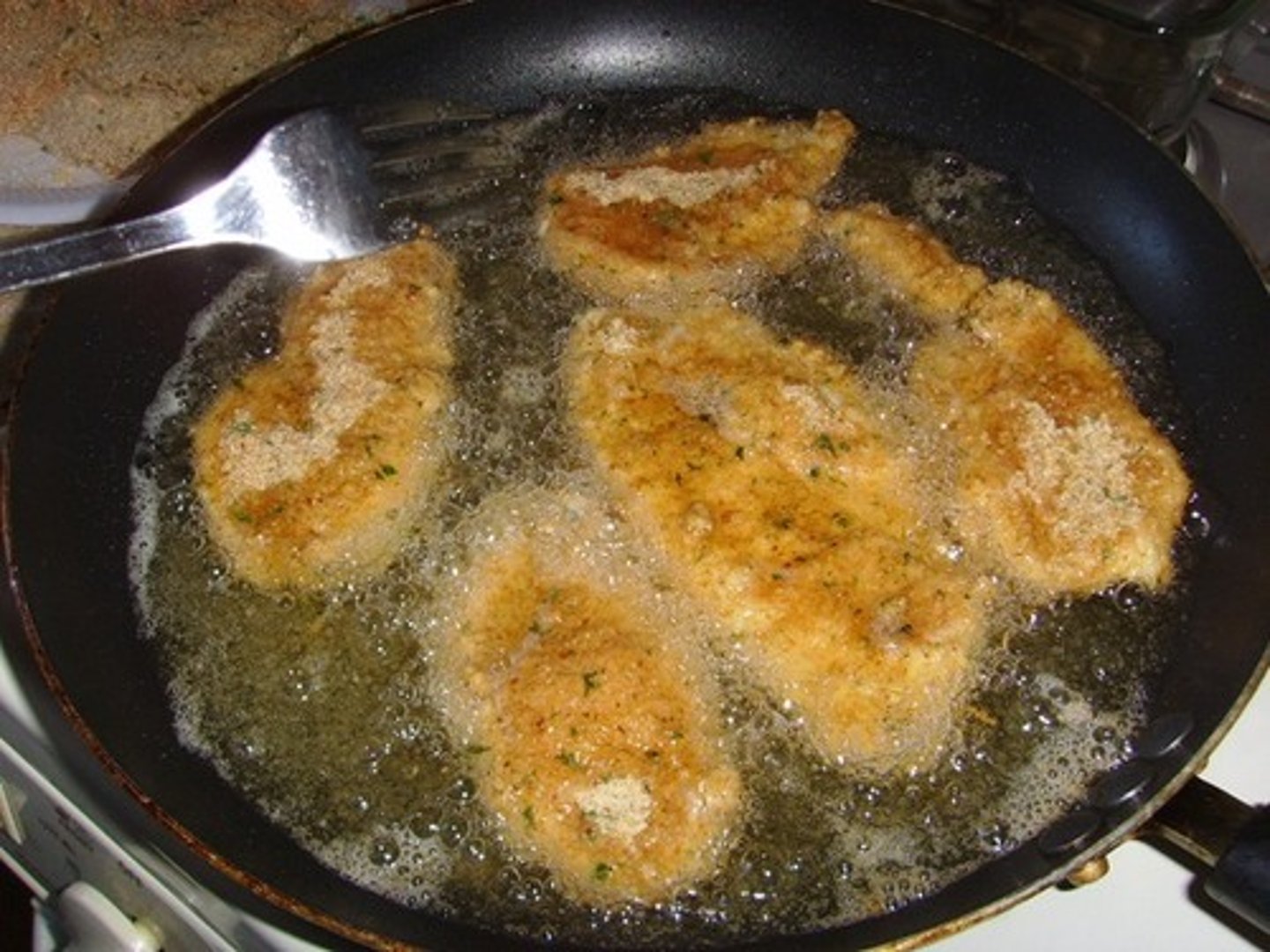 <p>(of food) make a hissing sound when frying or cooking</p><p>e.g.: The sausages are _____ing in the pan.</p>