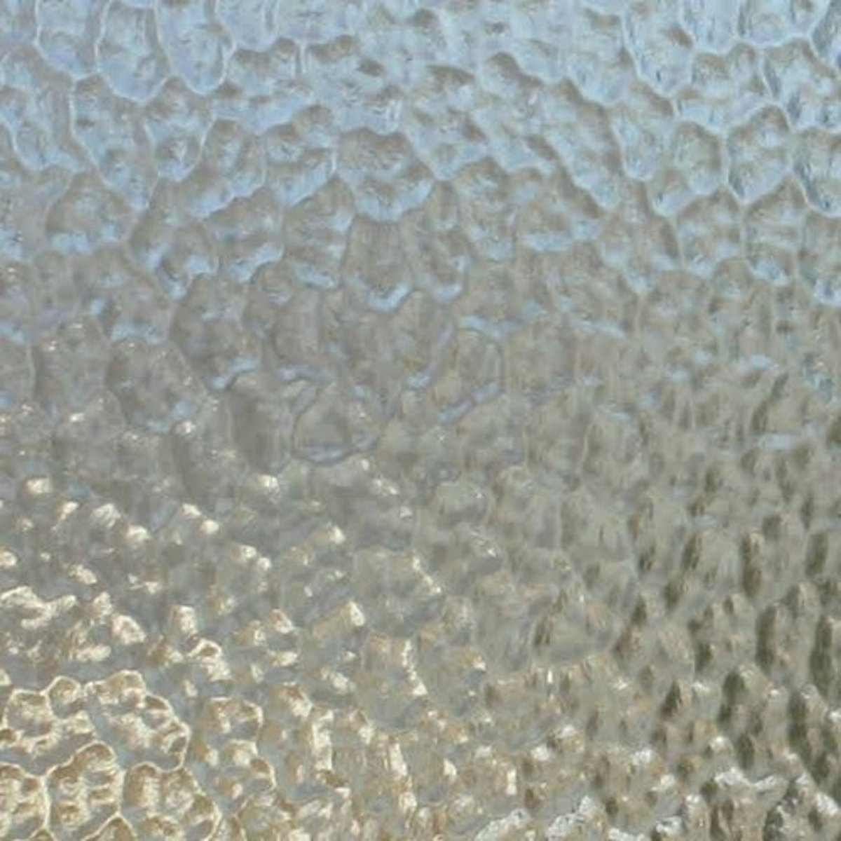 <p>Glass having one or both sides acid-etched or sandblasted to obscure vision. Weakens the glass and difficult to clean</p>