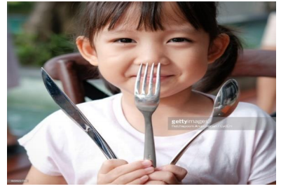 <p>be holding eating utensils</p>