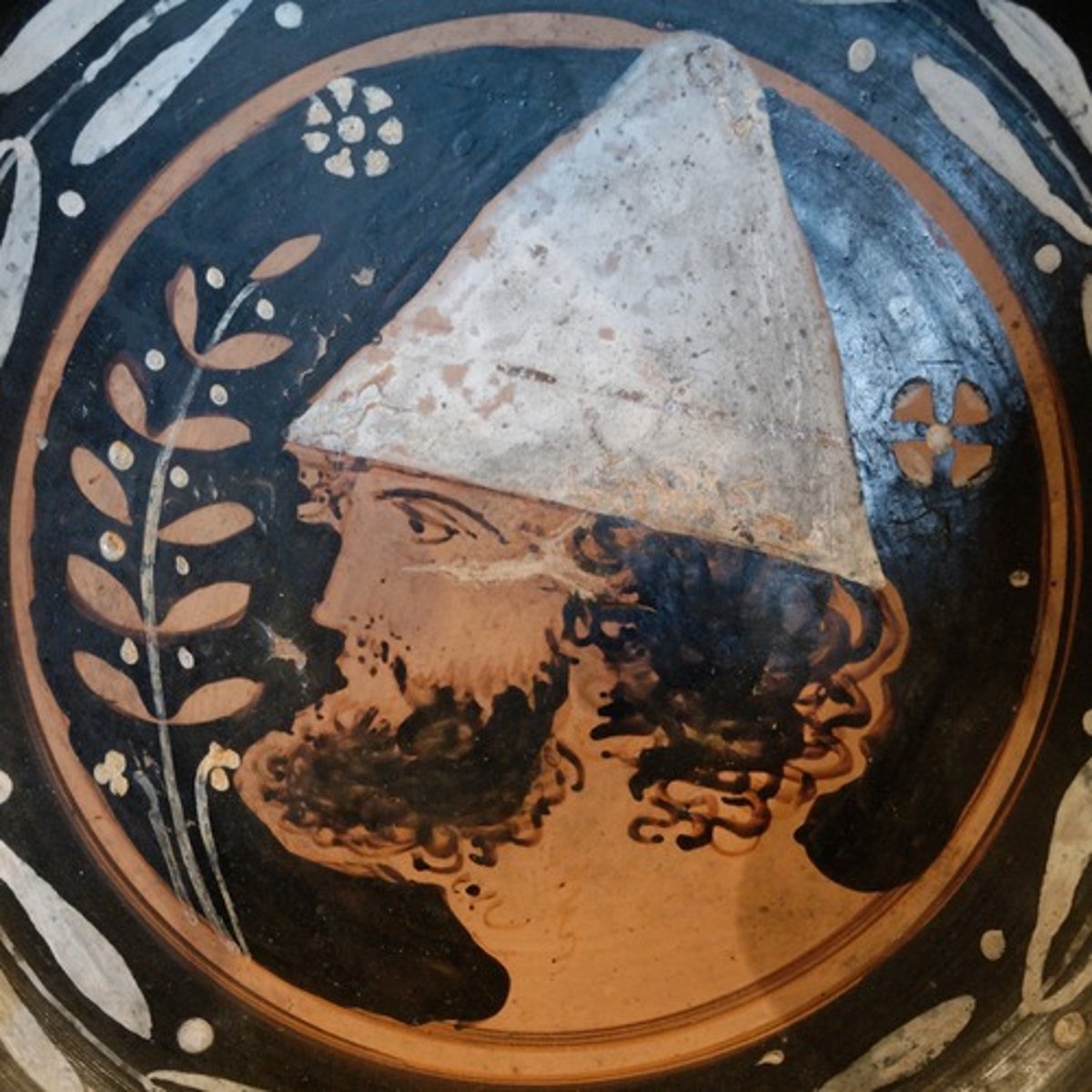 <p>freedman's cap worn by all during Saturnalia to symbolise equality</p>