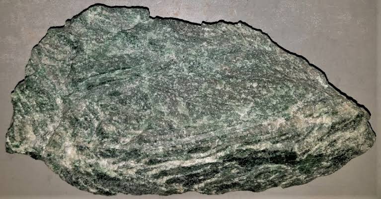 <p>Identify the igneous rock, its texture, and composition</p>