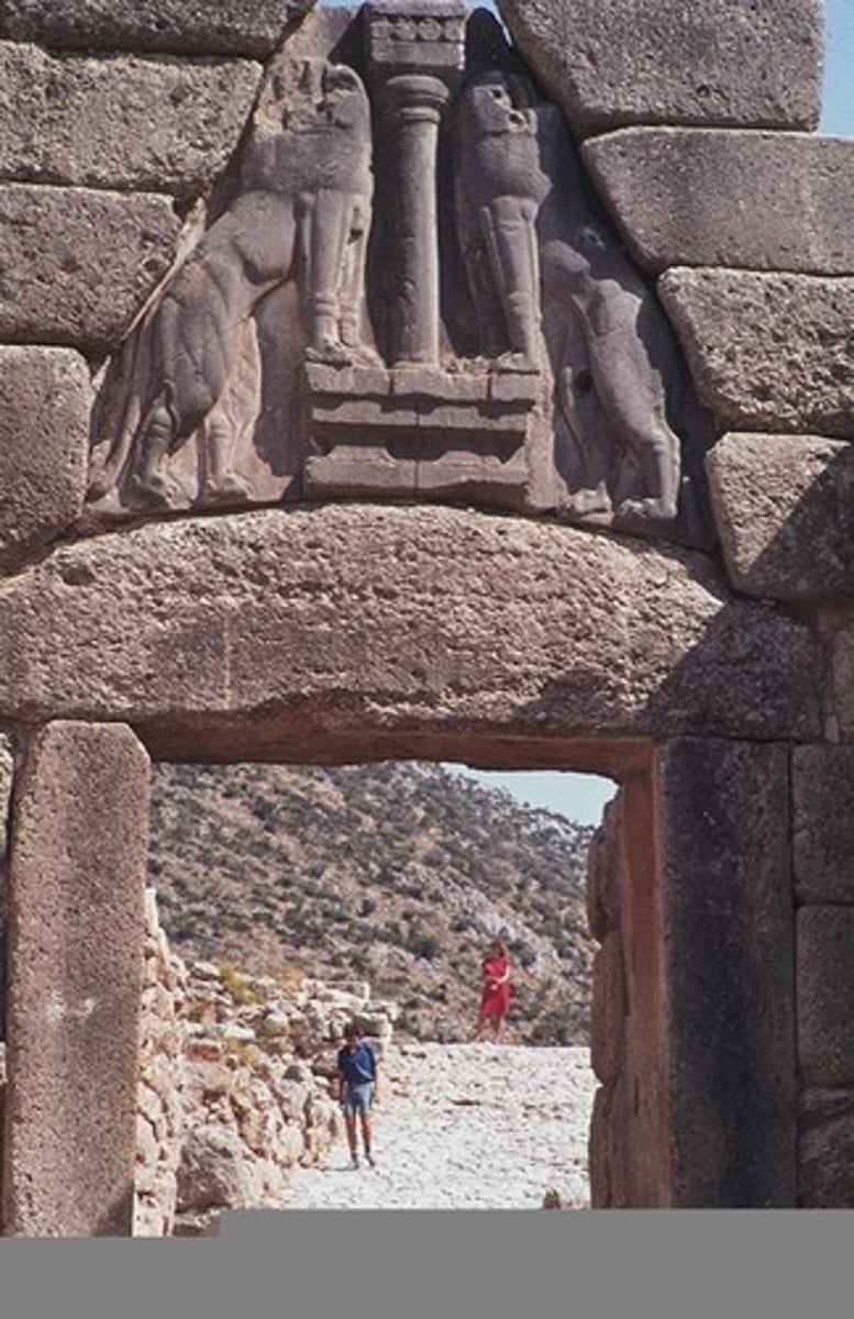 <p>- Lions have their paws on an altar while facing the front - solemn and majestic than outwardly fearsome—perhaps suggesting some sort of religious ties; gods support this city.</p><p>- Column and altar could represent the palace—physical and divine power</p><p>- Column is Minoan ( thicker at the top ) suggesting Minoan architecture has been used and Mycenaean art is being influenced by Minoan art.</p>
