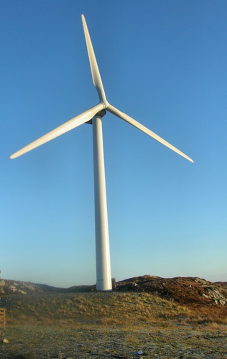 <p>A tall windmill which generates electricity from wind</p>