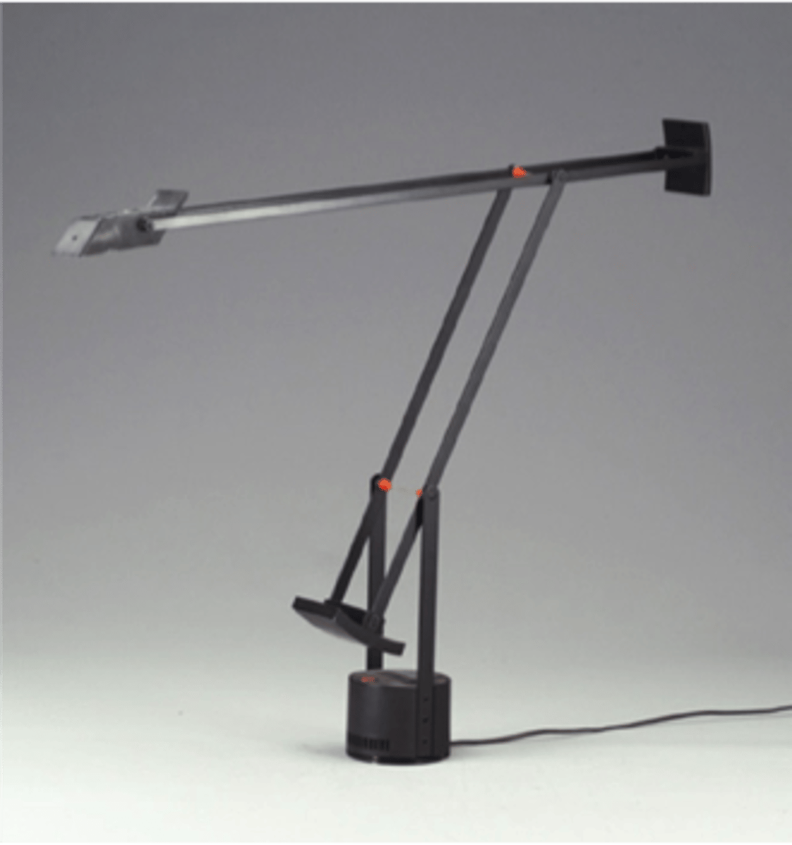 <p>-Tizio = "fellow" in Italian</p><p>-Transformer in base</p><p>-No cord running to bulb, electricity conducted along arms</p><p>-Push-pull adjustments (finger pads)</p><p>-Counter-balance: balances and stabilizes itself</p><p>-Golden means measurement</p><p>-Sculptural aesthetics</p>