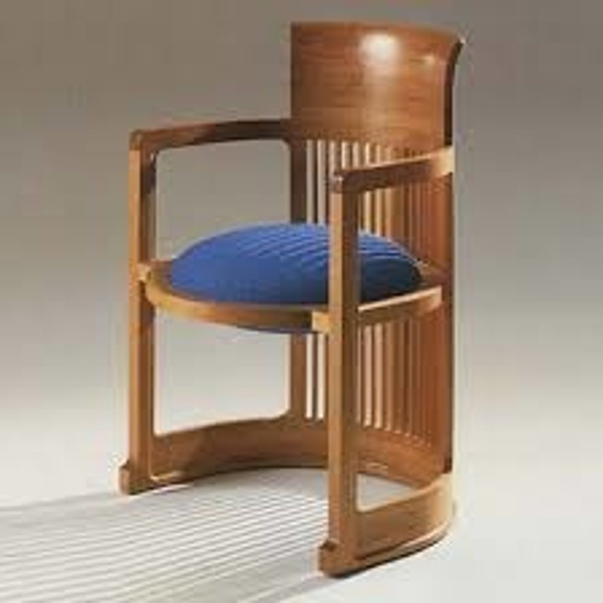 <p>A semicircular upholstered chair with a loose seat cushion.</p>