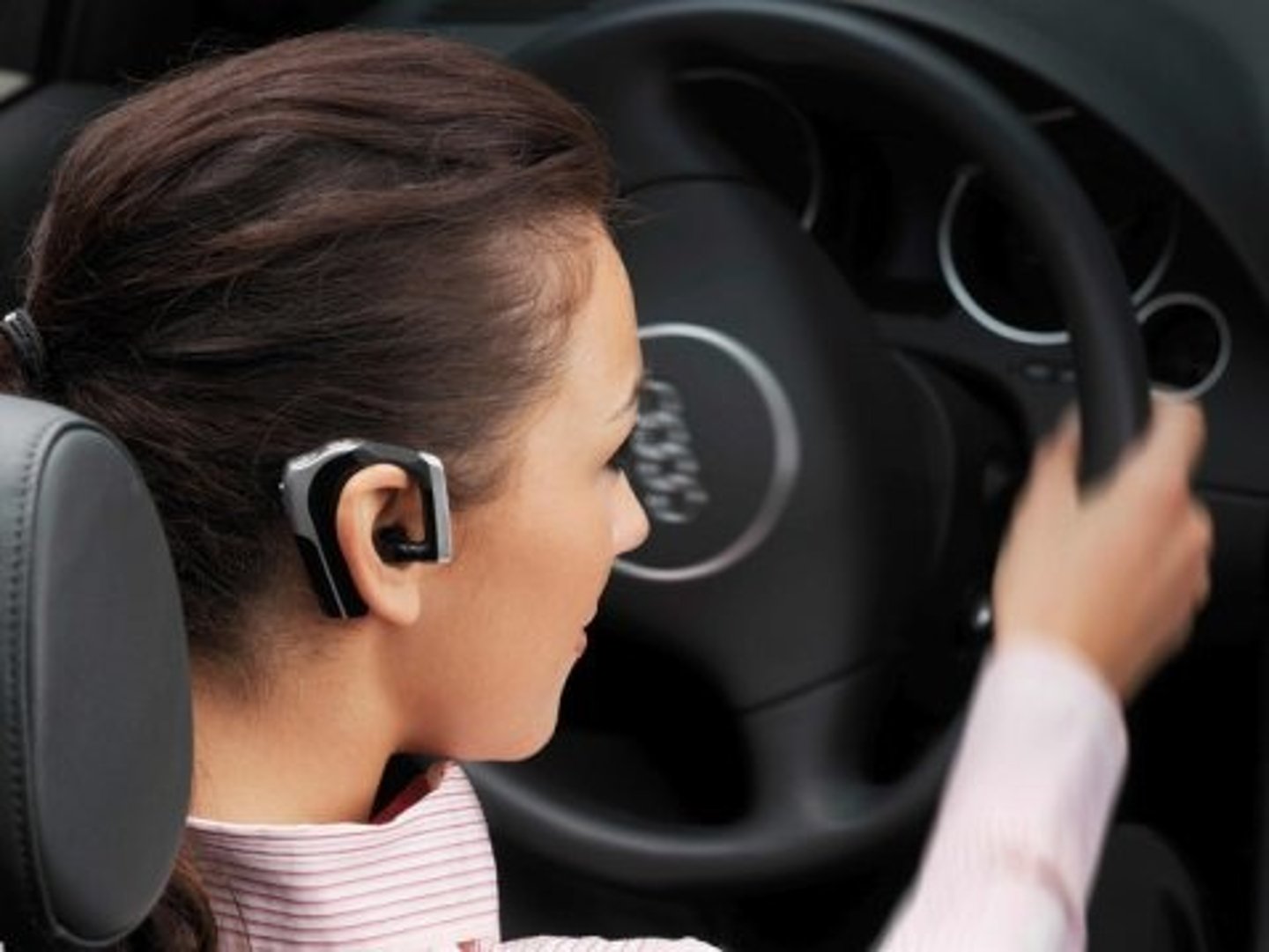 <p>Use hands-free devices so you can keep both hands on the steering wheel.</p>