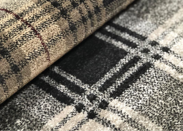 <p>produced on <strong><u>jacquard loom</u></strong> that was <u>developed in England</u></p><p>uses <u>preprogrammed pattern cards</u> that are <u>perforated and used to regulate the feeding of the colored yarn</u> into the carpet surface that allow complex pattern to be woven to the carpet, allowing several types of surface textures, from level cut pile to multilevel loop construction with limited ranges of color</p>