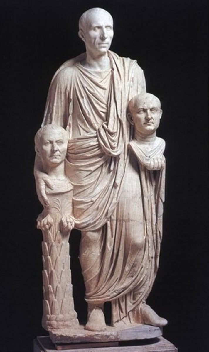<p>Rome, 50 BCE, marble, Republican Rome</p><p>around the first-century AD that depicts a full-body figure, referred to as a togatus, holding the heads of deceased ancestors in either hand.</p>