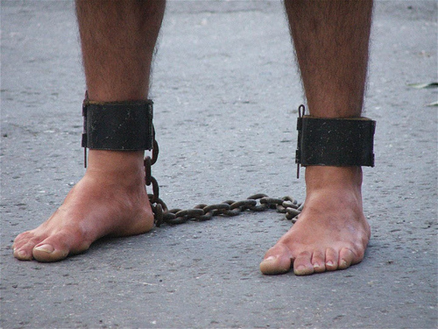 <p>(n.) a chain or shackle placed on the feet (often used in plural)</p><p>(v.) to chain or shackle; to render helpless or impotent</p><p>Synonyms: (n.) bond, restraint; (v.) bind, hamper</p><p>Antonyms: (v.) free, liberate, emancipate</p>