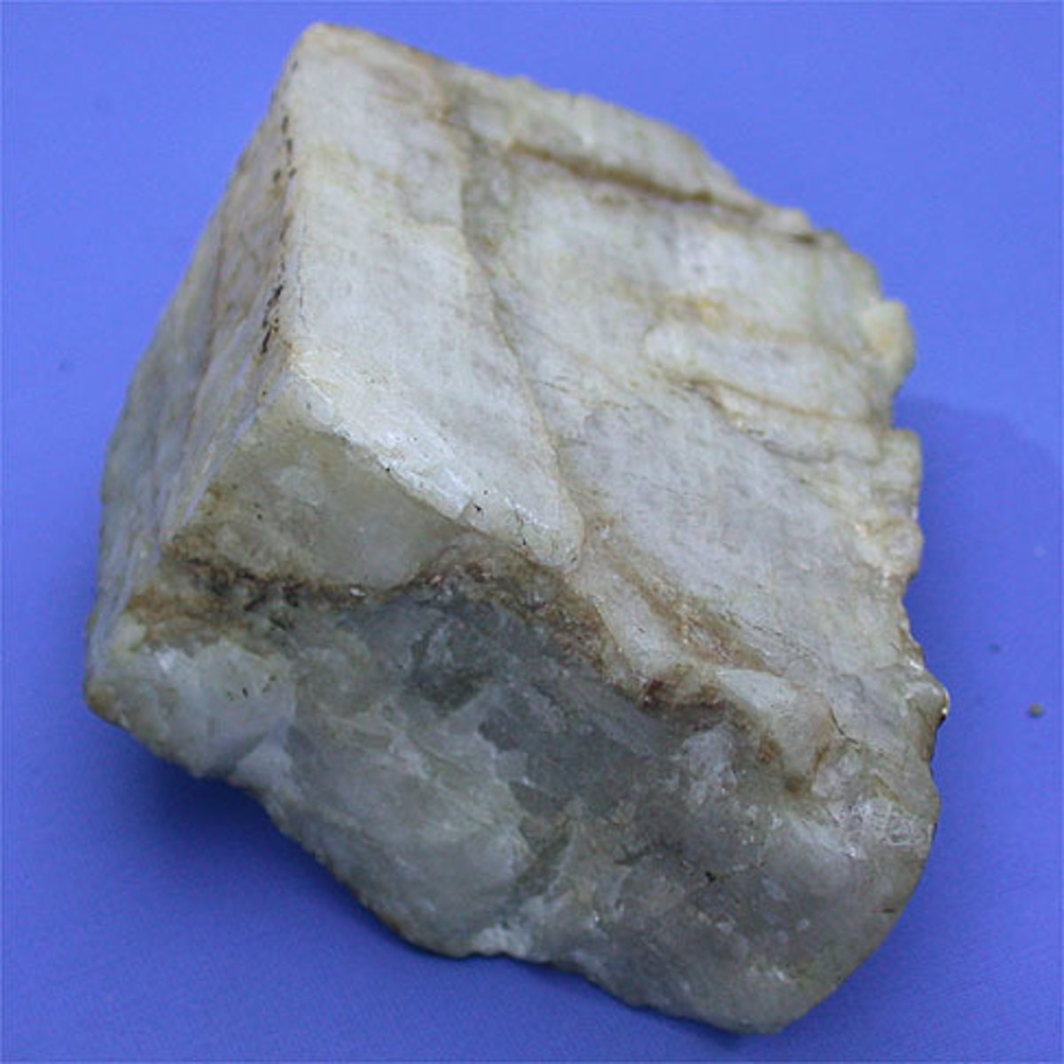<p><strong>hardness:</strong> 6<br><strong>cleavage:</strong> 2 directions, at 90 degrees<br><strong>luster: </strong>vitreous to pearly<br><strong>color:</strong> white, grey, blue green with parallel veins<br><strong>other notes:</strong> almost like a crystal</p>