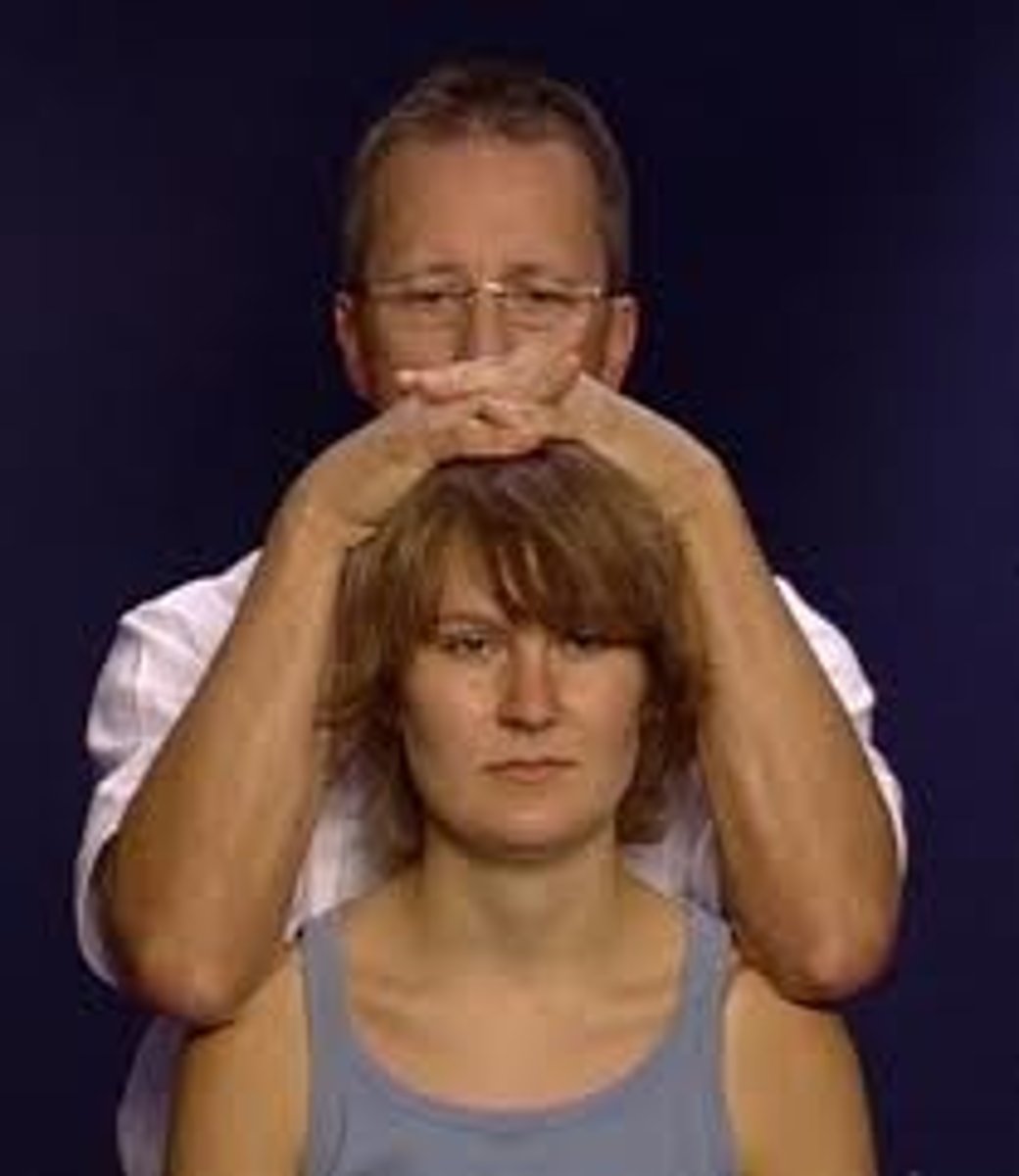 <p>- pt seated or supine</p><p>- sxs relief with traction: nerve root compression or facet joint unloading</p><p>- sxs reproduction with compression: disc, facet joint irritation, foraminal narrowing, fracture</p>