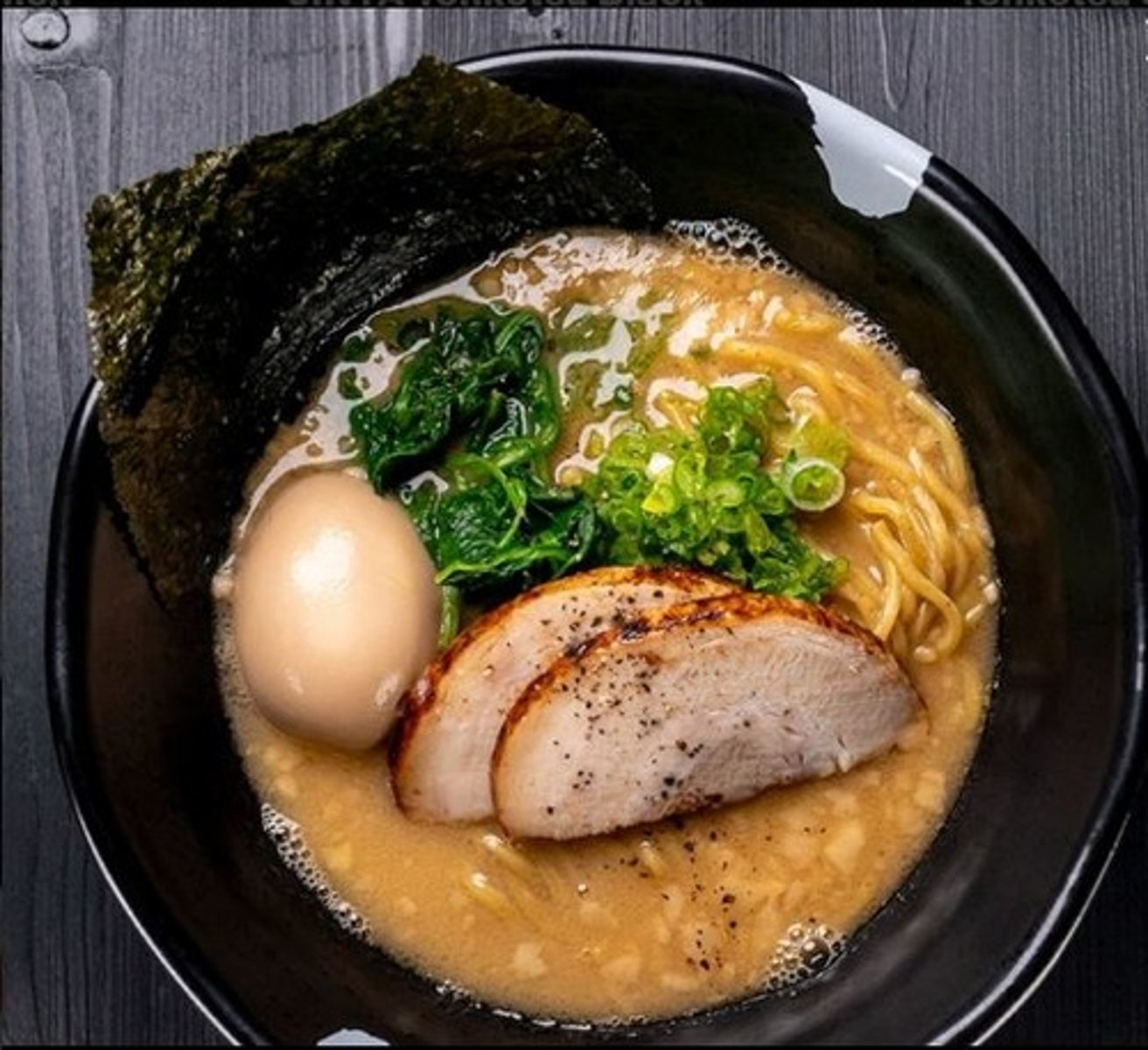 <p>Pork broth, Pork chashu, Green onion, Spinach, Egg, Nori, Extra thick noodles</p>