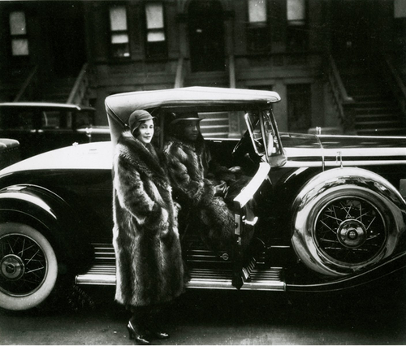<p>James Van Der Zee, mostly photographic portraits, many wedding pictures or pics of celebrities, connects important cultural events, great migration, civil rights, posed people to portray charisma and success, in photograph, couple wearing fur coats and in front of rare cadillac</p>