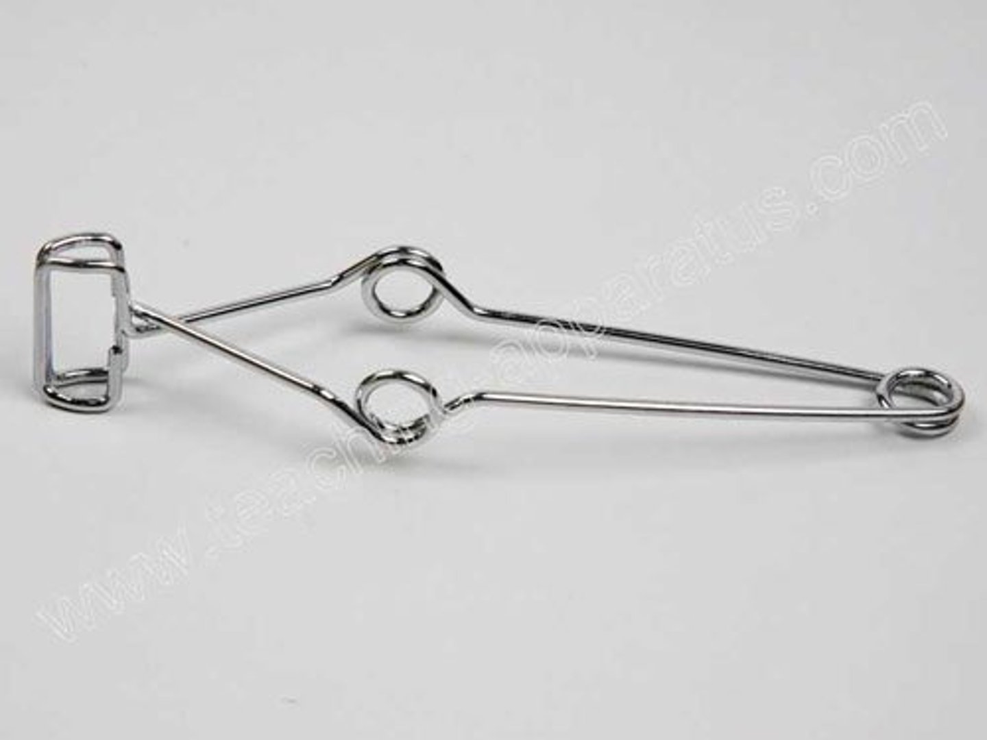 <p>a clamp secures the test tubes in place</p>