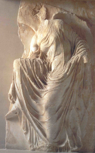 Marble. 
Depicts a goddess in a very normal, informal way
Pull of gravity, unclear if putting sandal on or taking it off. 
Drapery puts emphasis on balance and female anatomy. 
High relief