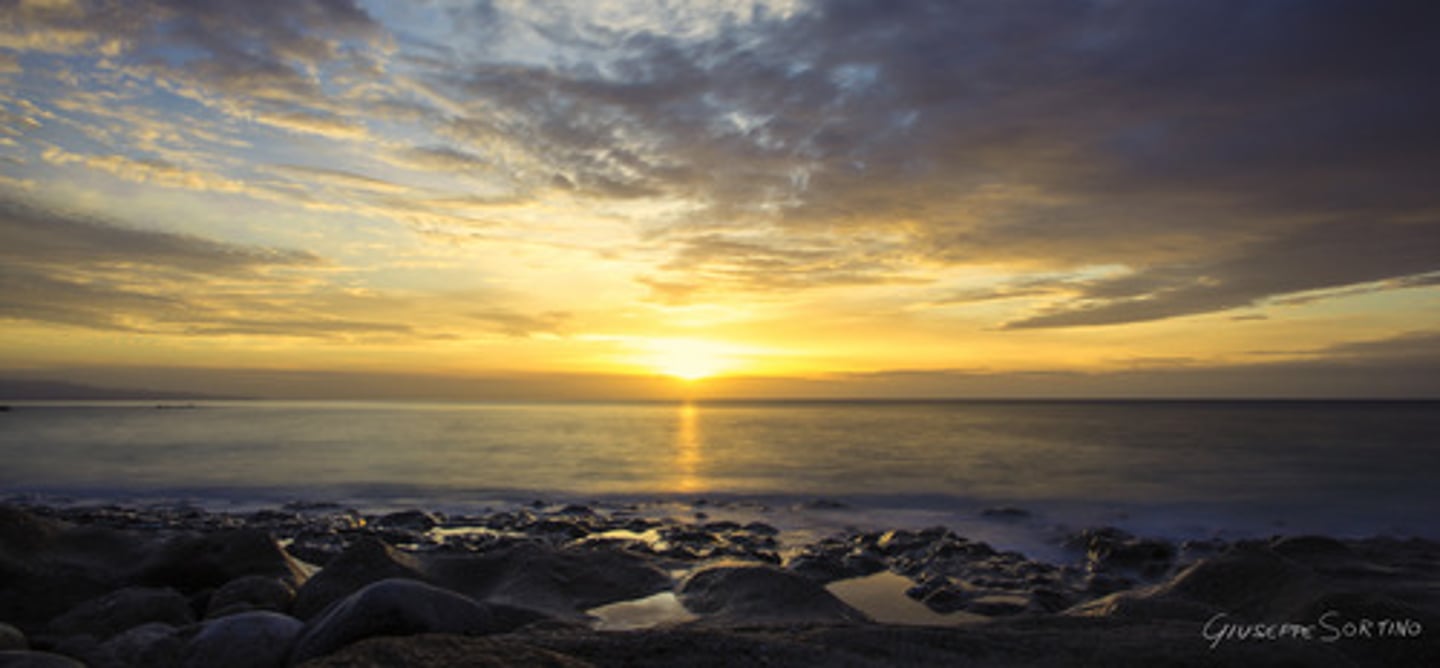 <p>(adj) completely surrounding, encompassing</p>