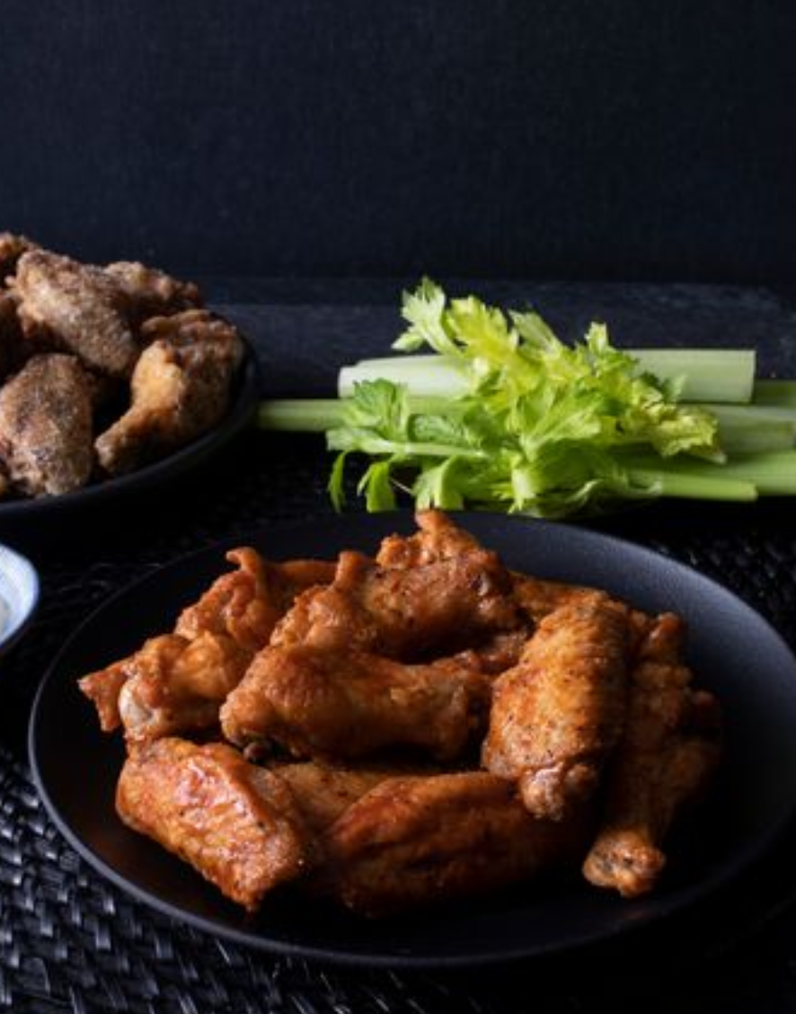 <p>louisiana hot or salt and pepper, served with celery sticks and creamy parmesan dip.</p>
