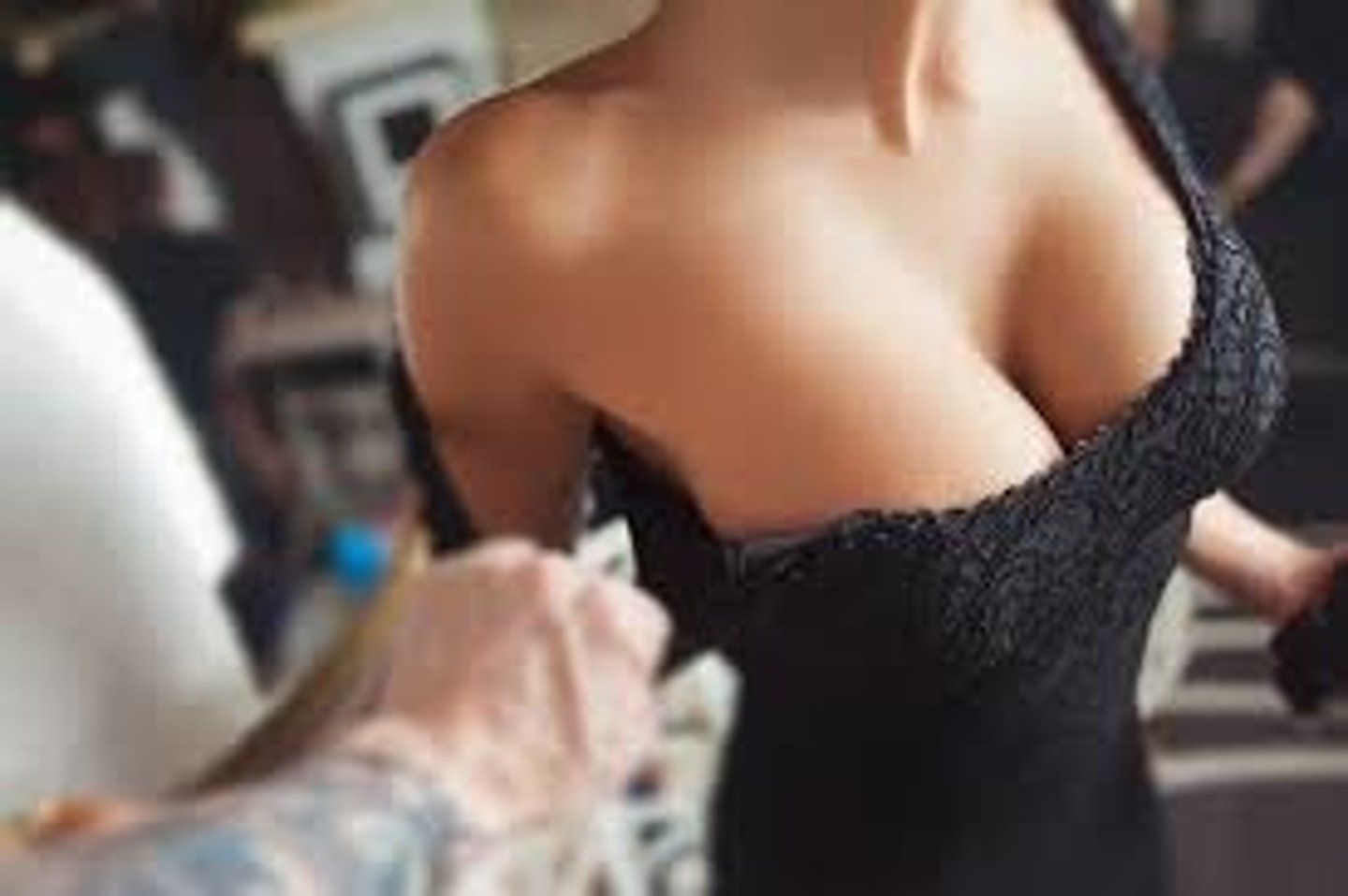 <p>"cut low at the neckline"</p>