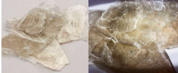 <p>KAl_2Si_3ALO_10(OH)_2     Perfect basal sheet like cleavage, micaceous, hexagonal. elastic sheet growth. Colourless to pale green/yellow. </p>