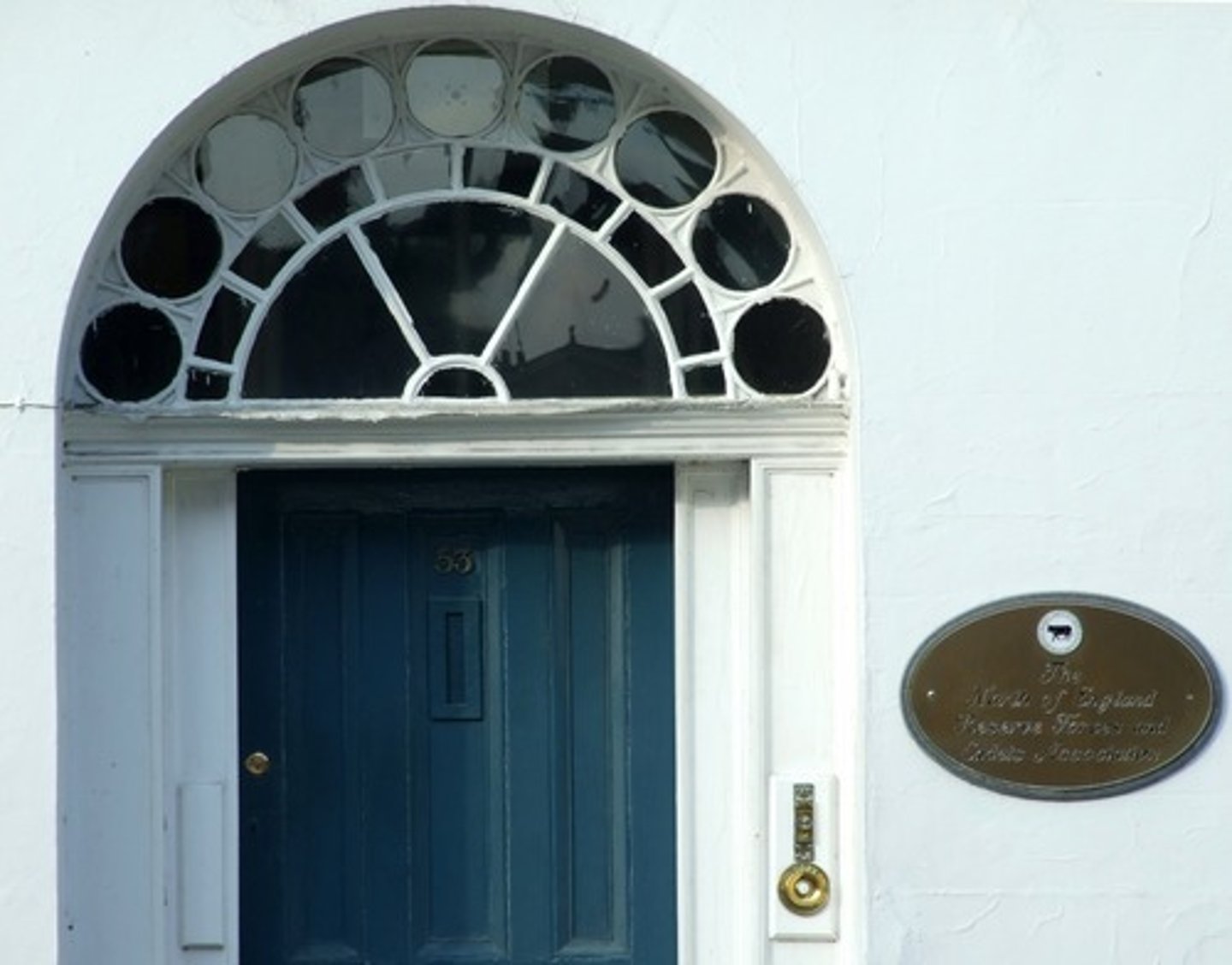 <p>a door opening, with a semicircular window (fanlight above and flanked by vertical windows (sidelights)); similar to Palladian window</p>