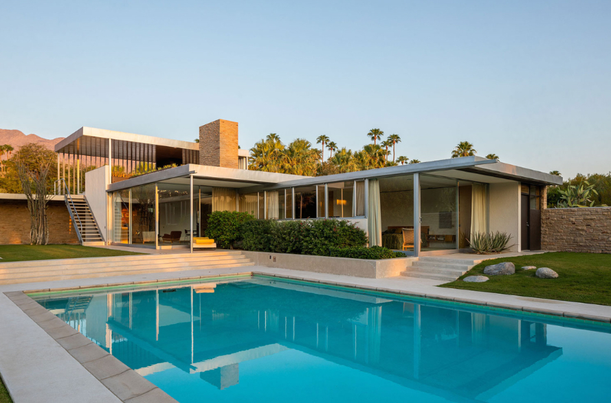 <p><span><span>Flat roofs, desert setting, glass walls</span></span></p>