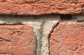 <p>a mixture used in building to bind bricks or stones together.</p>