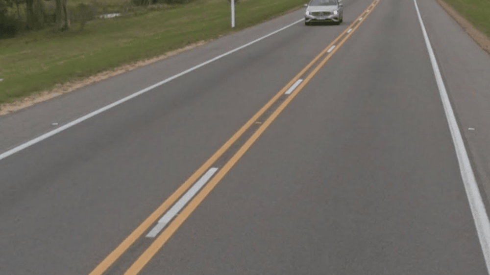 <p>Triple road lines in the Americas (Double yellow with white dashes in between them)</p>