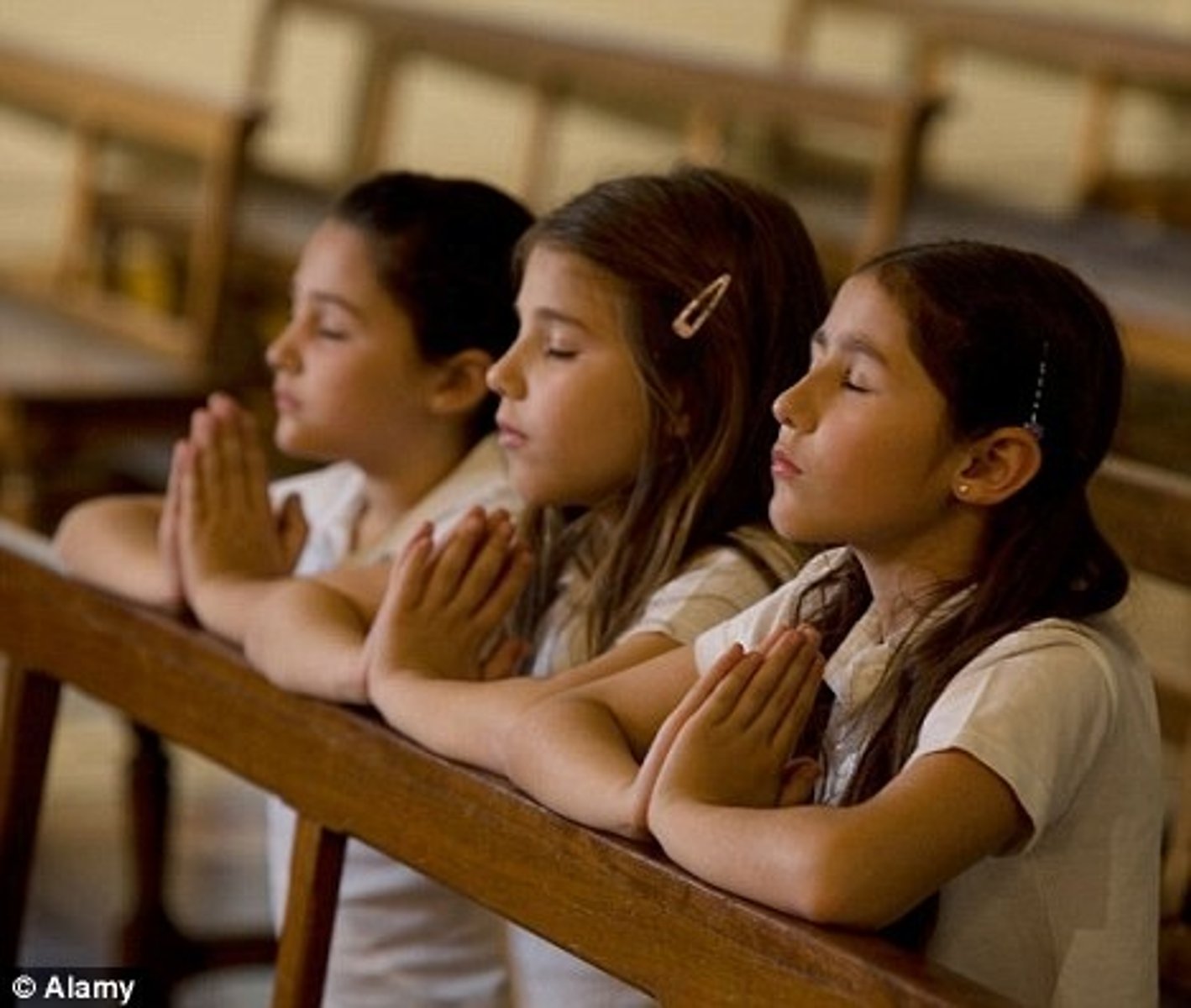<p>Devoutly religious (reverent, sanctimonious)</p>