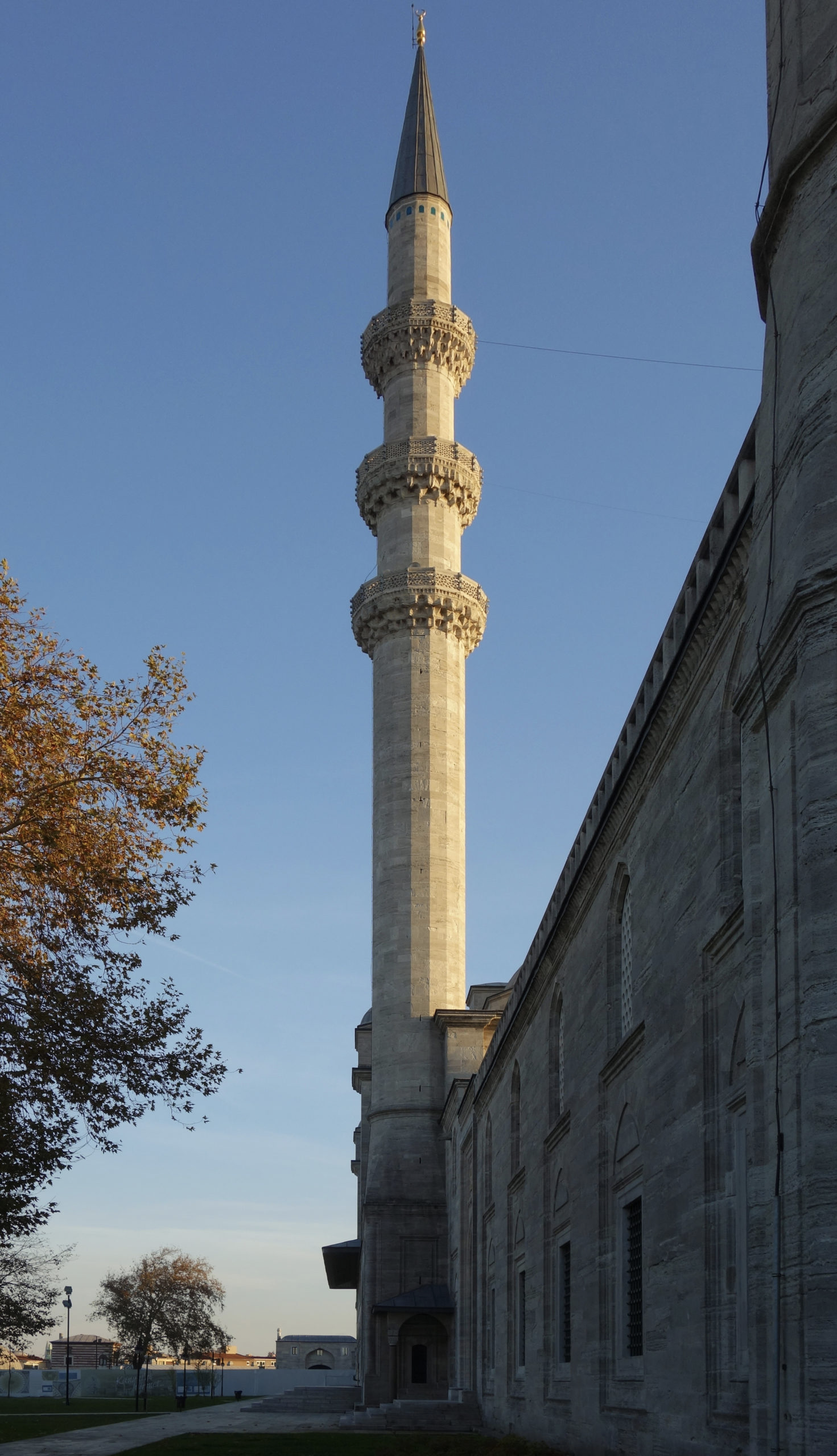 <p>A tall slender tower, typically part of a mosque, contains a balcony from which a muezzin calls Muslims to prayer.</p>