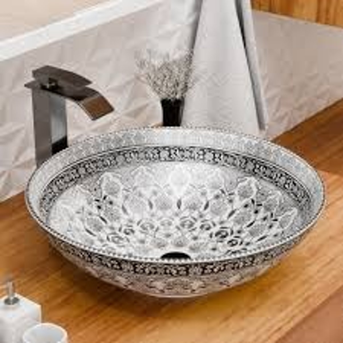 <p>A low area of land surrounded by higher land; like a bowl.</p>