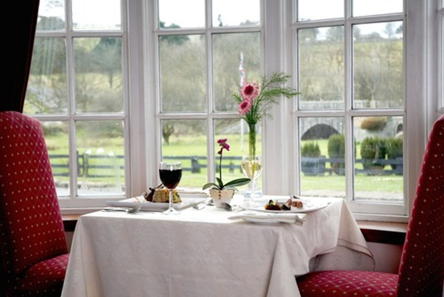 <p>The table is by the window.</p>