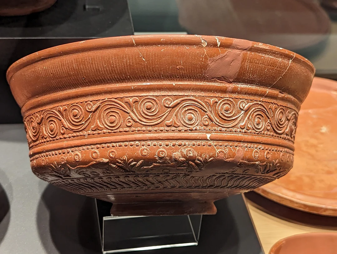 <p>a red-slipped earthenware associated with ancient Greece and Rome</p><ul><li><p>refers to a red or black earthenware slip or "slip glaze" often used for painting elaborate scenes</p></li></ul><p></p>