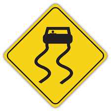 The road surface is slippery when it is wet. This sign is often located near bridges and overpasses.