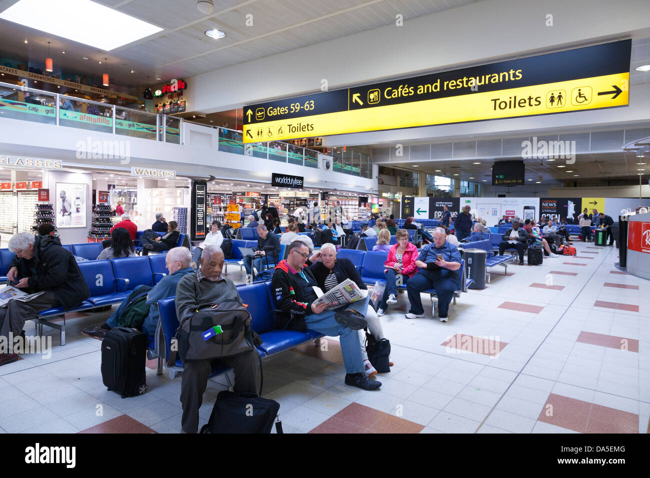 the area in an airport where passengers wait before getting onto an aircraft