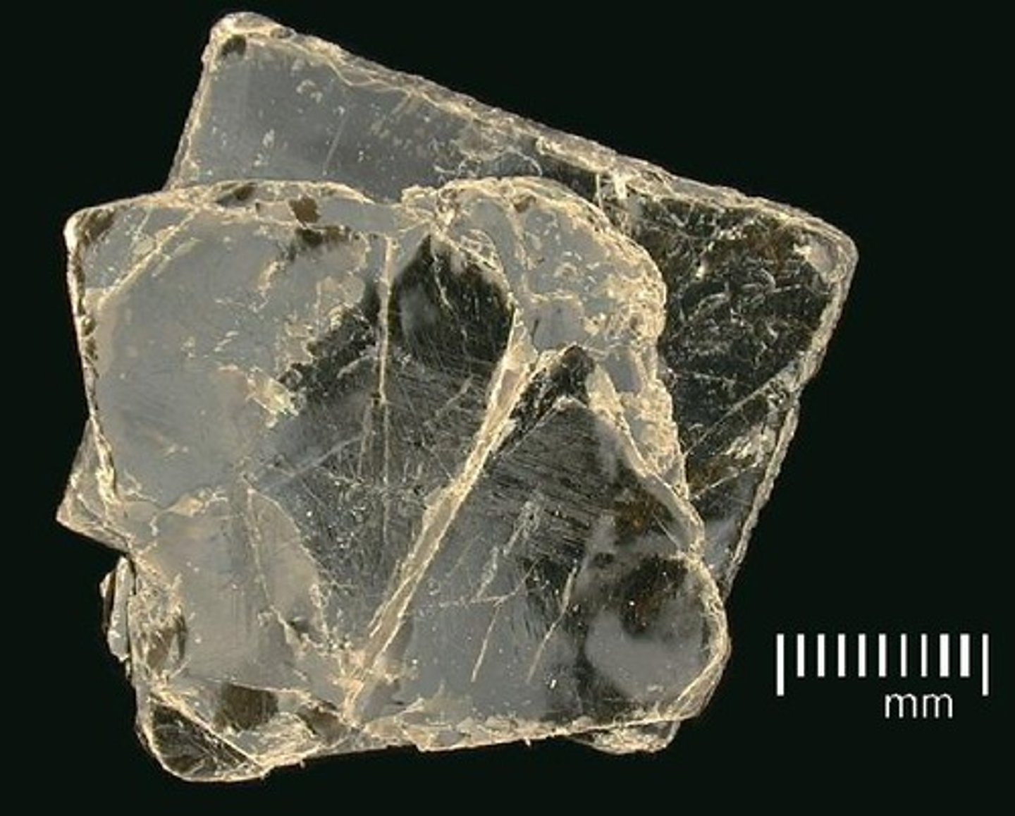 <p>look at broken surface of mineral for flat edges</p>