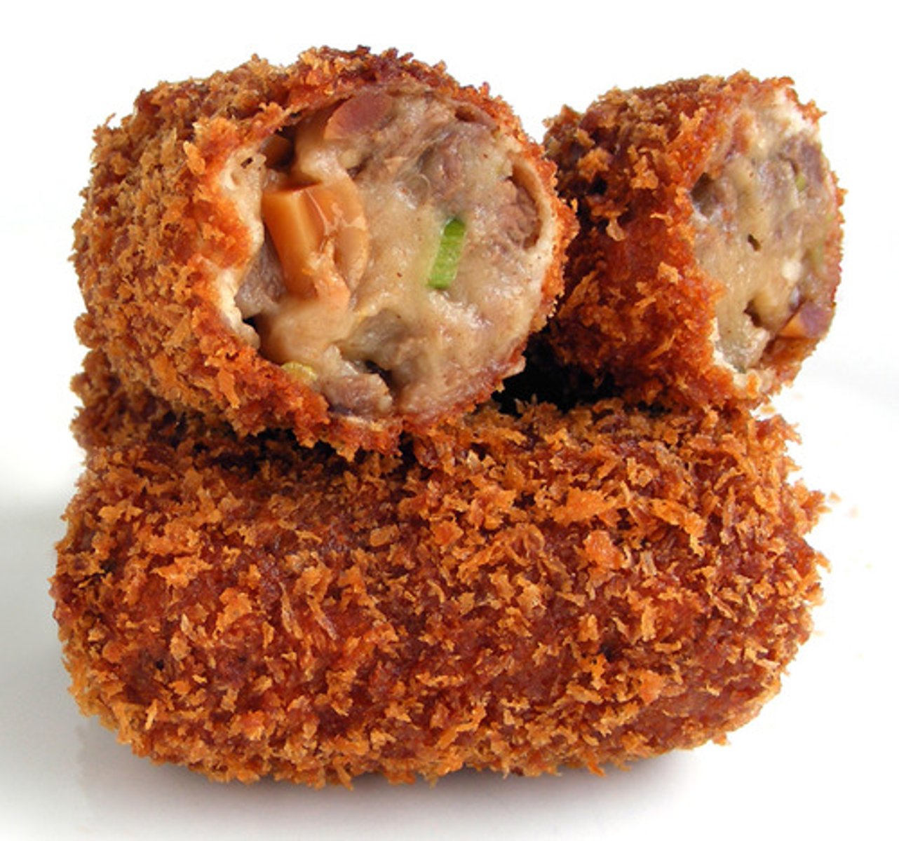 <p>a small roll of chopped vegetables, meat, or fish, fried in breadcrumbs.</p>