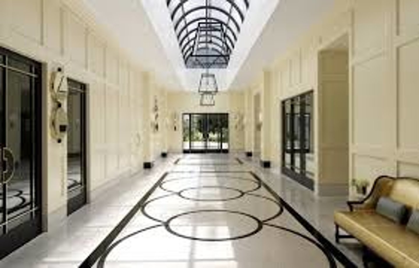 <p>a large open space inside the entrance of a theatre or hotel where people can meet or wait</p>