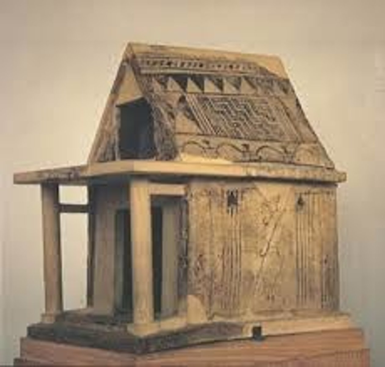 <p>Clay miniature shrine form from the Middle Geometric period (ca. 900-850 BCE) that possibly reflects early temple architecture or hero cults.</p>