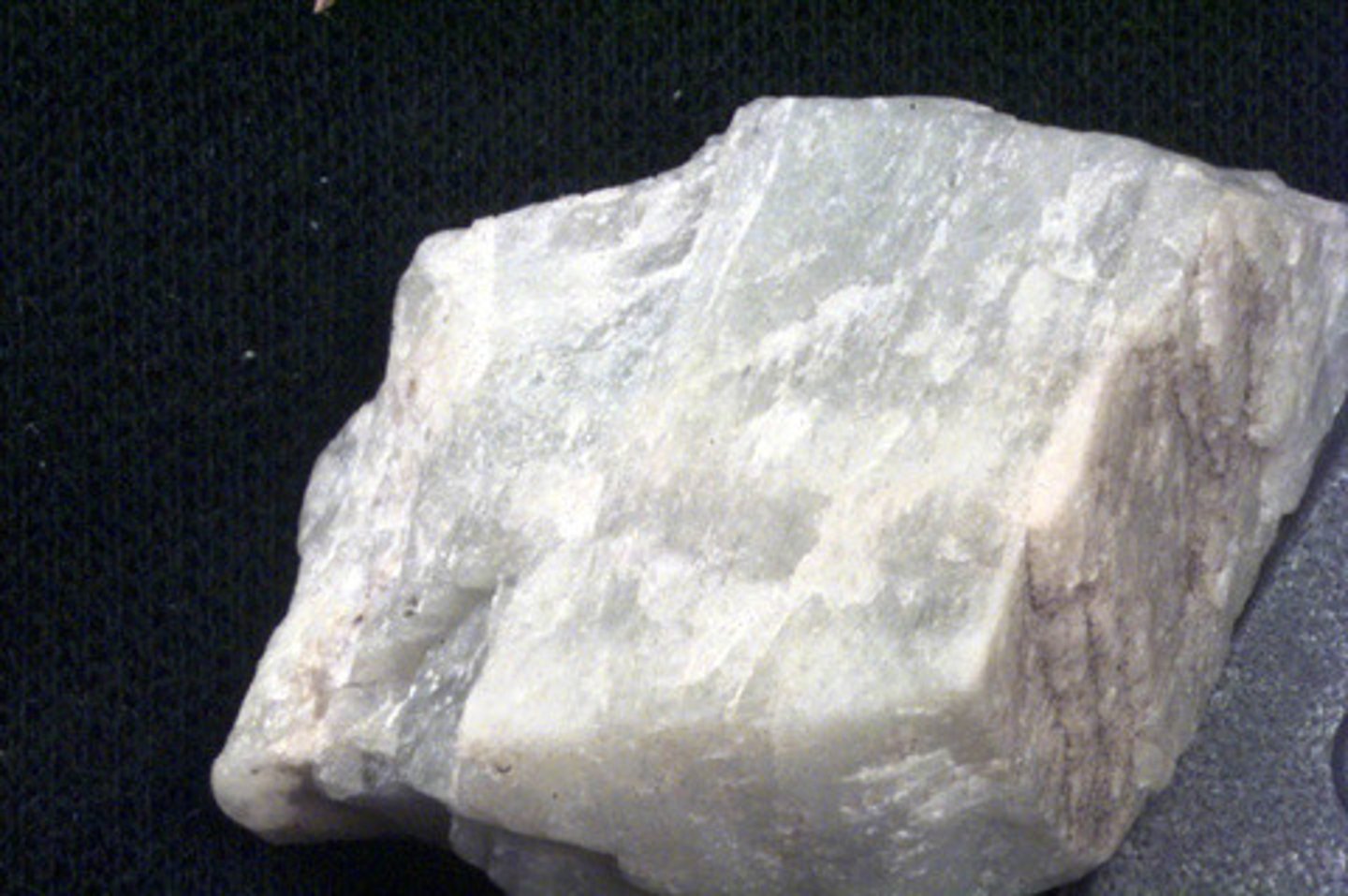 <p>Mineral<br>Color: Usually white or gray. Also colorless, yellow, orange, pink, red, brown, black, blue, green.<br>Streak: White<br>Luster: Vitreous<br>Cleavage: Perfect in 2 directions that intersect at 90 degrees<br>Hardness: 6.0-6.5<br>Specific Gravity: 2.6-2.8</p>