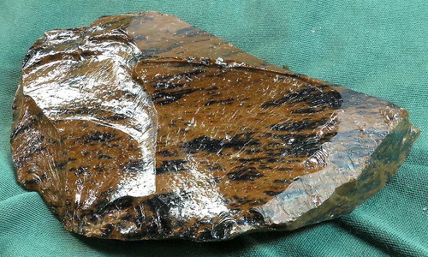 <p>volcanic rock - (quickly-cooled, fine-grained or glassy)</p>