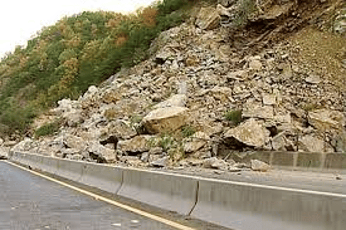 <p>Loose rocks fall down a steep slope</p>