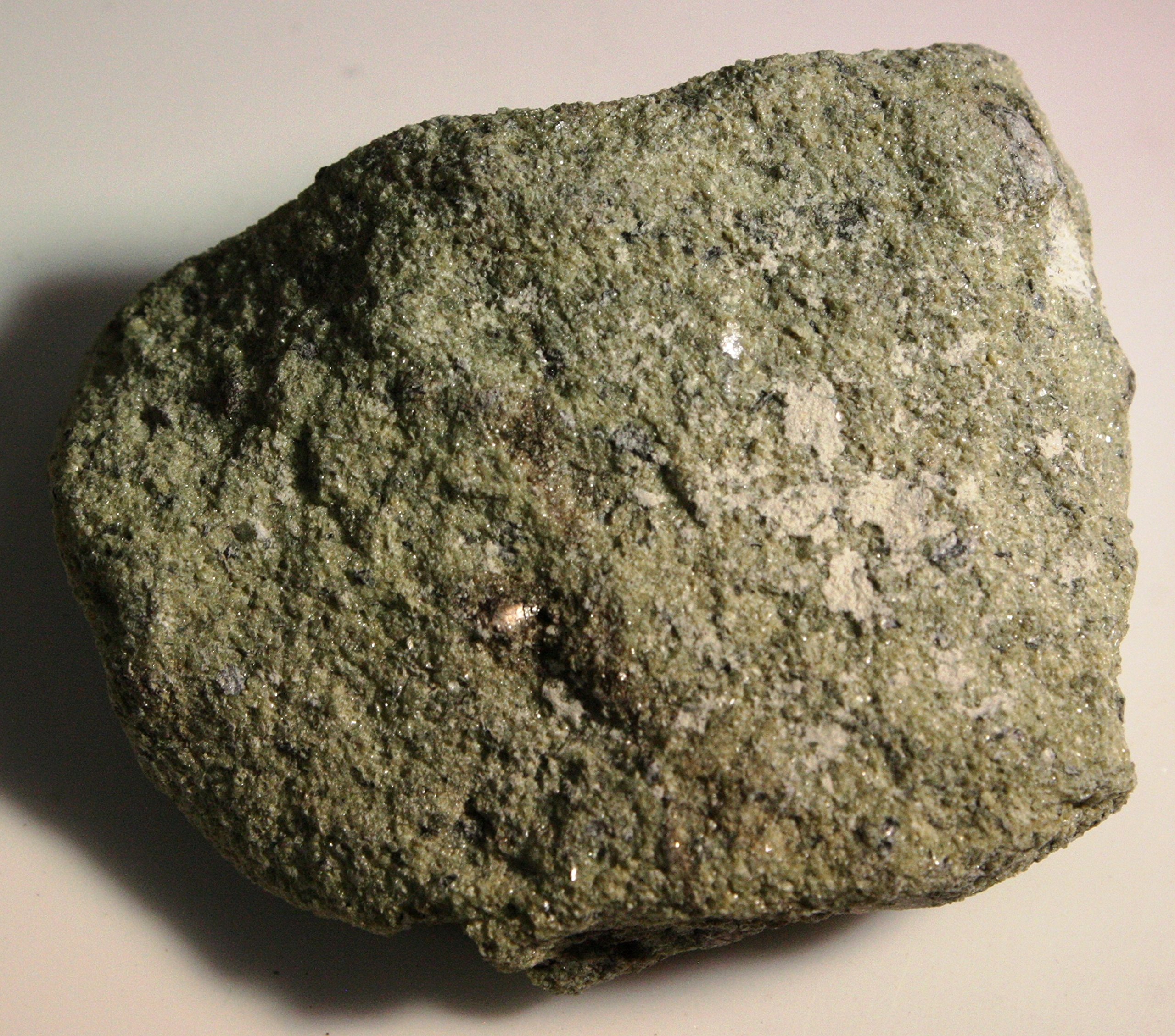 <p>Mineral: Olivine</p><p><span style="font-family: arial">Olivine is usually green in color but can also be yellow-green, greenish yellow, or brown. It is transparent to translucent with a glassy </span><a target="_blank" rel="noopener noreferrer nofollow" href="https://geology.com/minerals/luster.shtml"><strong>luster</strong></a><span style="font-family: arial"> and a </span><a target="_blank" rel="noopener noreferrer nofollow" href="https://geology.com/minerals/mohs-hardness-scale.shtml"><strong>hardness</strong></a><span style="font-family: arial"> between 6.5 and 7.0. It is the only common igneous mineral with these properties. The properties of olivine are summarized in the table.</span></p>